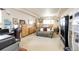 Spacious primary bedroom with neutral carpet, a sitting area, and natural light, creating a relaxing retreat at 24191 E Iowa Pl, Aurora, CO 80018