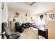 Bedroom with a comfortable looking recliner, well lit window, and display shelves at 24191 E Iowa Pl, Aurora, CO 80018