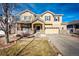 Attractive two-story residence boasts a stone entryway, covered porch, and attached two car garage at 24191 E Iowa Pl, Aurora, CO 80018