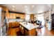 Spacious kitchen featuring stainless steel appliances, a central island, and a dining area at 24191 E Iowa Pl, Aurora, CO 80018