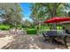 Relaxing back patio with outdoor seating and beautiful landscaping, perfect for entertaining at 7800 Indiana St, Arvada, CO 80007