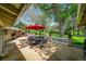 Inviting outdoor patio area with dining set, perfect for entertaining or relaxing in the backyard at 7800 Indiana St, Arvada, CO 80007