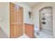 Modern bathroom with a glass-enclosed shower, sleek fixtures, and tile flooring at 7800 Indiana St, Arvada, CO 80007