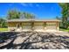 Spacious three-car garage with ample parking space and a clean brick exterior at 7800 Indiana St, Arvada, CO 80007