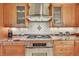 Gourmet kitchen featuring stainless steel appliances, granite countertops, and stylish cabinetry at 7800 Indiana St, Arvada, CO 80007