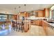 Spacious kitchen with stainless steel appliances, a center island, and ample cabinet space at 7800 Indiana St, Arvada, CO 80007