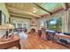 Inviting living room with wood floors, fireplace, and an abundance of natural light at 7800 Indiana St, Arvada, CO 80007