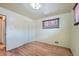 An empty bedroom with hardwood floors and a closet at 6991 Warren Dr, Denver, CO 80221