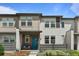 Charming townhome with a welcoming entrance and modern architectural details at 4774 Kittredge St, Denver, CO 80239