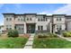 Inviting townhome with a manicured lawn and charming front porch, creating curb appeal at 4774 Kittredge St, Denver, CO 80239