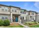 Charming townhome with a welcoming entrance and modern architectural details at 4774 Kittredge St, Denver, CO 80239