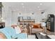 Bright open-concept living room with modern furnishings, hardwood floors, and access to a chef-inspired kitchen at 4774 Kittredge St, Denver, CO 80239