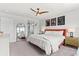 Bright main bedroom boasts stylish decor, large windows, and ample natural light at 4774 Kittredge St, Denver, CO 80239