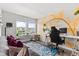 Comfortable office features bright natural light, hardwood floors, and unique decor at 4774 Kittredge St, Denver, CO 80239