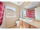 Cozy bathroom with a shower-tub combination, a large window and neutral-colored walls at 13078 Monaco Way, Thornton, CO 80602