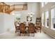 Elegant dining room features a large table, ornate chairs, and a stylish chandelier at 13078 Monaco Way, Thornton, CO 80602