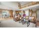 Open-concept living space showcases a kitchen, breakfast nook, and living room with comfortable furniture at 13078 Monaco Way, Thornton, CO 80602