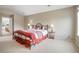 Spacious bedroom with a comfortable bed, side tables, and ample lighting at 13078 Monaco Way, Thornton, CO 80602