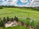 Gorgeous backyard features fire pit, waterfall, and sprawling green space at 4586 Carefree Trl, Parker, CO 80134