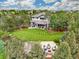 Gorgeous backyard features a lush lawn, patio, fire pit, and waterfall at 4586 Carefree Trl, Parker, CO 80134