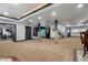 Spacious basement featuring a golf simulator and gym, offering diverse recreation and fitness options at 4586 Carefree Trl, Parker, CO 80134