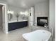 Bathroom with double vanity, fireplace and freestanding soaking tub at 4586 Carefree Trl, Parker, CO 80134