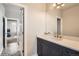 Bathroom featuring single vanity, tiled floors, and open doorway at 4586 Carefree Trl, Parker, CO 80134