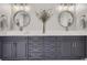 Bathroom features a double vanity with stone countertop and large round mirrors at 4586 Carefree Trl, Parker, CO 80134