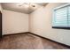 Bedroom with neutral walls, carpet, ceiling fan, and natural light at 4586 Carefree Trl, Parker, CO 80134