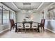 Elegant dining room with a modern chandelier and a dark wood table at 4586 Carefree Trl, Parker, CO 80134