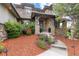 Inviting front entrance with stone accents, lush landscaping, and a well-manicured lawn at 4586 Carefree Trl, Parker, CO 80134