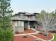 Charming stone-clad home featuring a well-manicured yard and inviting front porch at 4586 Carefree Trl, Parker, CO 80134