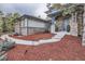 Beautiful home with stone facade and a well-maintained front yard and walkway at 4586 Carefree Trl, Parker, CO 80134