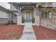 Inviting front entrance with stone accents, decorative plants, and a charming water feature at 4586 Carefree Trl, Parker, CO 80134