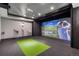 Incredible home golf simulator room with a large screen for immersive practice and entertainment at 4586 Carefree Trl, Parker, CO 80134