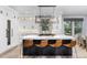 Gourmet kitchen with a large center island, state-of-the-art appliances, and stylish pendant lighting at 4586 Carefree Trl, Parker, CO 80134