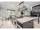 Open-concept kitchen with a central island, modern appliances, and seamless flow to dining at 4586 Carefree Trl, Parker, CO 80134