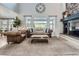 Inviting living room with high ceilings, a cozy fireplace, and scenic outdoor views at 4586 Carefree Trl, Parker, CO 80134