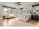 Bright main bedroom featuring large windows and a sitting area at 4586 Carefree Trl, Parker, CO 80134