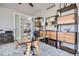 Bright home office with large glass doors and wooden storage at 4586 Carefree Trl, Parker, CO 80134