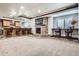 Finished basement featuring a bar, stone fireplace, carpet, and trim lighting at 4586 Carefree Trl, Parker, CO 80134