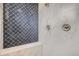 Shower featuring decorative tile wall with a built in bench seat at 4586 Carefree Trl, Parker, CO 80134