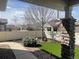 Landscaped backyard featuring artificial turf, gravel beds, a sidewalk, and a privacy fence at 19753 E 54Th Ave, Denver, CO 80249