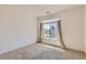 Bedroom with plush carpeting, bright windows, and scenic outside view at 19753 E 54Th Ave, Denver, CO 80249