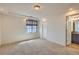 Bedroom with a large window and attached bathroom at 19753 E 54Th Ave, Denver, CO 80249