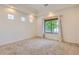 Bright and airy bedroom with ample natural light, neutral carpeting, and a recessed ceiling at 19753 E 54Th Ave, Denver, CO 80249