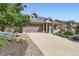 Charming home with stone accents, a spacious driveway, and mature landscaping for enhanced curb appeal at 19753 E 54Th Ave, Denver, CO 80249