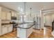 Modern kitchen featuring stainless steel appliances, granite countertops, and a functional center island at 19753 E 54Th Ave, Denver, CO 80249