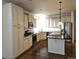 Spacious kitchen featuring stainless appliances, granite countertops, and beautiful hardwood floors at 19753 E 54Th Ave, Denver, CO 80249