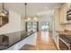 Bright kitchen with stainless steel appliances, a center island, and open floor plan, perfect for entertaining at 19753 E 54Th Ave, Denver, CO 80249